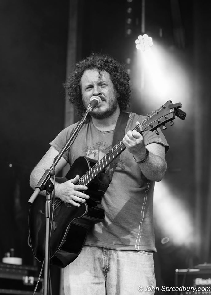 dramatic shot of kev, mid-singing when he opened Phoenix festival