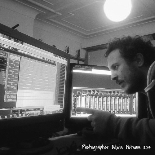 kev staring at a computer screen with fancy music production stuff on it